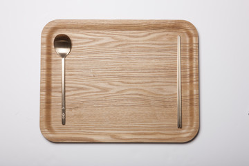 woman hand hold a wood tray isolated white.