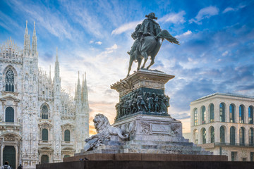 Piazza del Duomo, Milan, Italy. Equestrian monument to Vittorio Emmanuele II at dawn. In the background the cathedral of Milan