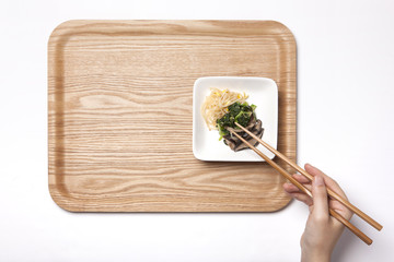 woman hand hold a food tray isolated white.
