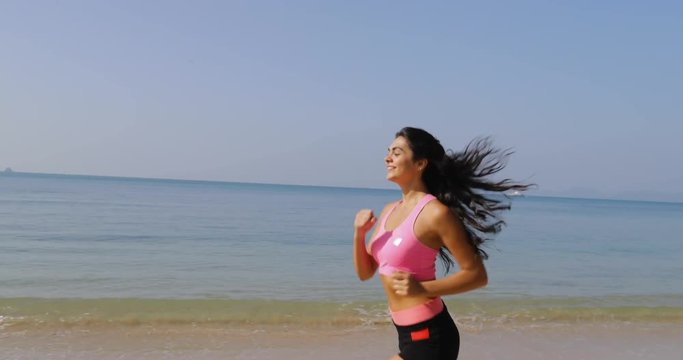 Running Girl On Beach Young Woman Athlete Jogging Training Outdoors Exercising On Seaside Fit Beautiful Athletic Female Working Out Side View Slow Motion 60