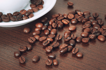 Cup of coffe beans on a table