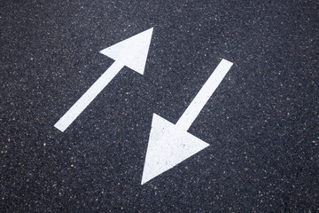 Direction sign on the asphalt road