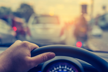 vintage tone blur image of people driving car on day time.