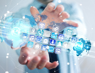 Businessman connecting worlds to icons and applications software 3D rendering