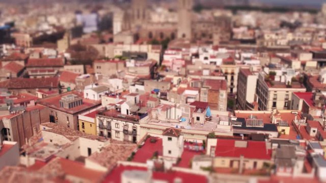 Barcelona dwelling houses rooftops, Spain. 4K pan video, tilt-shift lens miniature effect