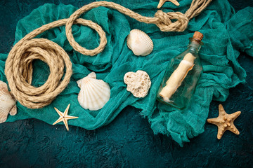 Seashells on dark turquoise background