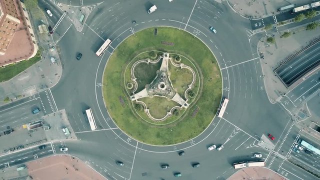 Aerial rising shot of Plaza de Espana in Barcelona, Spain. Roundabout city traffic, top view. 4K video