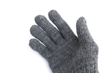 hand in right grey knitted glove on white background