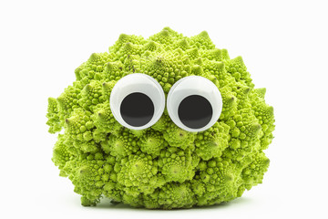 green cauliflower with googly eyes on white background