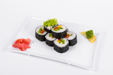 Asia. Vegetarian vegetable rolls on a white plate on a white background