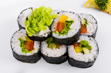 Asia. Vegetarian vegetable rolls on a white plate on a white background