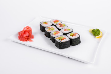 Asia. Rolls with salmon (red fish) on a white plate on a white background