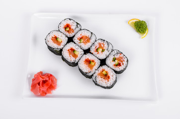 Asia. Rolls with salmon (red fish) on a white plate on a white background