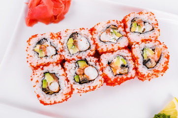 Asia. California rolls on a white plate on a white background