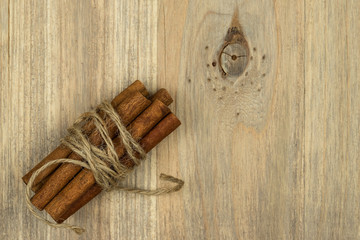 Cinnamon sticks on the black wooden table. Fresh cinnamon.