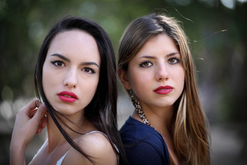 Two girlfriends together blond and brunette
