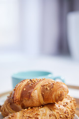 breakfast in bed with coffee and croissants