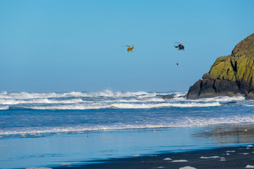 Pacific coast, USA. Coast guard helicopters in the sky.