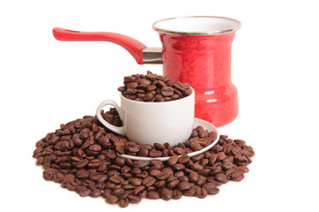 Coffee beans and a white cup on white background