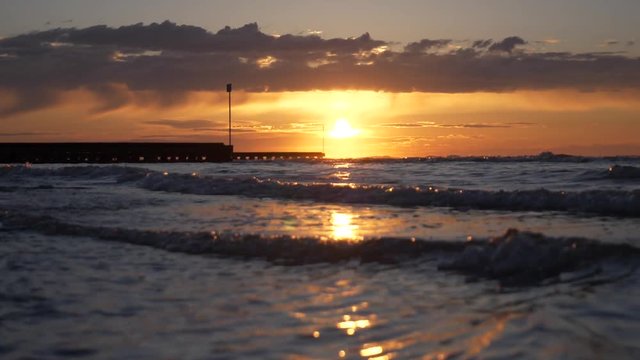 Scenic view of ocean against cloudy sky during sunrise at jesolo beach, near venice, italy