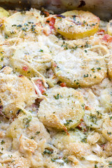 Potatoes and tomatoes baked with cheese