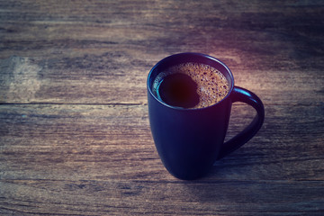 black coffe mug on wood table - Vintage effect style pictures