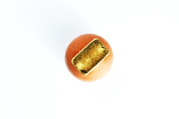 Gold bar put on the small jar represent business concept.