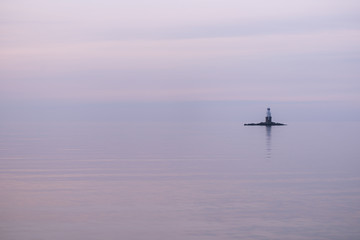 Fototapeta na wymiar Calm sea lighthouse