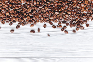 coffee beans on a white wooden background