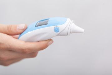 Sick women with a thermometer