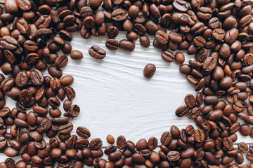 Frame of coffee beans on a white background
