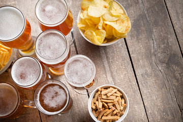 glass beer on wood background