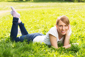 Young woman resting on the grass