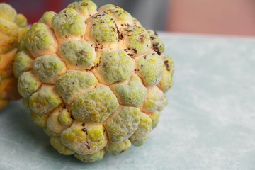 custard apple ripe on floor. no retouch skin, organic fruit and Vegetables concept.(custard apple, annona, sweetsop)