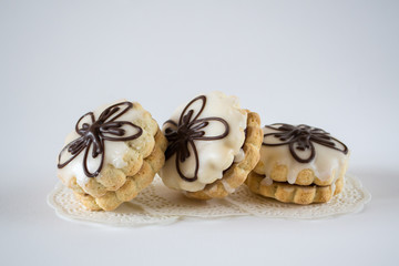 Obraz na płótnie Canvas Homemade gingerbread cookies with jam and glaze on white background