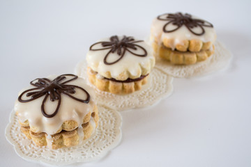 Homemade  gingerbread cookies with jam and glaze on white background