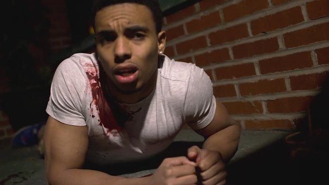 Young Male Shooting Victim Reacting To Gun Shots
