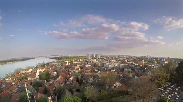 BELGRADE, SERBIA - APRIL 2017: Time lapse of idyllic panorama on city at sunset. Very popular tourist activity is watching Danube river and cityscape from Gardos tower. 