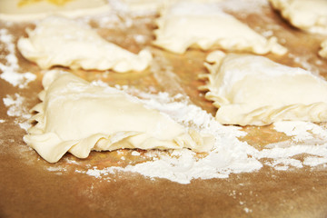 Preparation of pies with cabbage and spices.