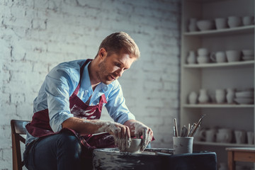 Young potter at work