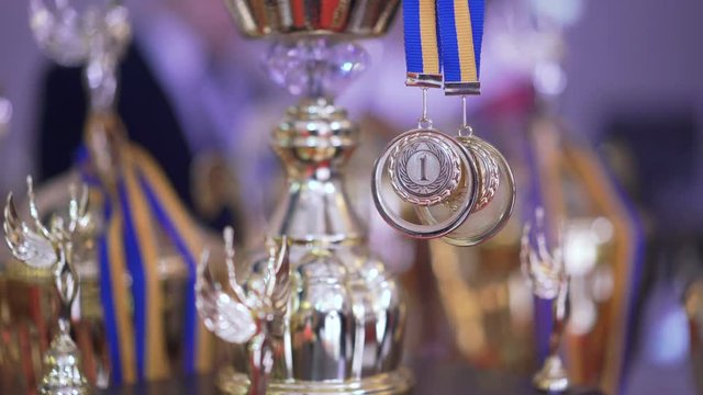 Close up of golden trophies on competition in 4K