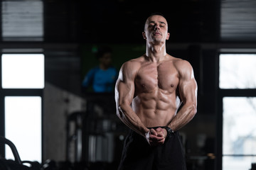 Fototapeta na wymiar Man Showing Abdominal Muscle
