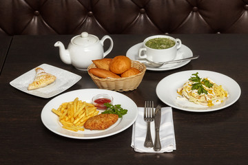 Tasty food, complex lunch on wooden table