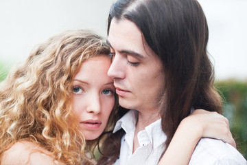 young beautiful couple long haired nature