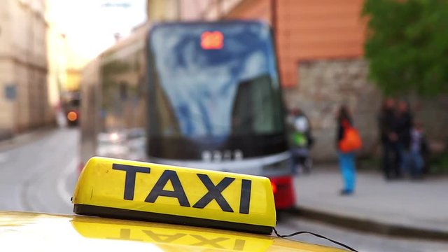 Taxis waiting for passengers on the street near the tram stop