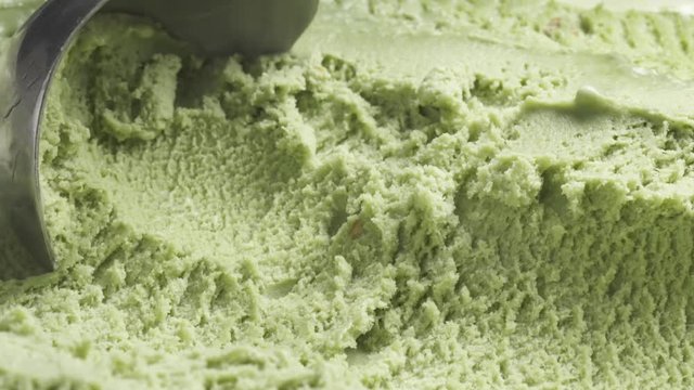 Slow motion of pistachio ice cream being scooped close up, 60fps prores footage