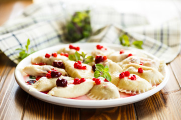 Sweet boiled dumplings with cherries and berries