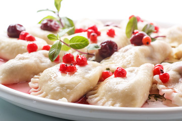 Sweet boiled dumplings with cherries and berries
