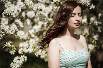 beautiful brunette spring apple flowers walk in the park