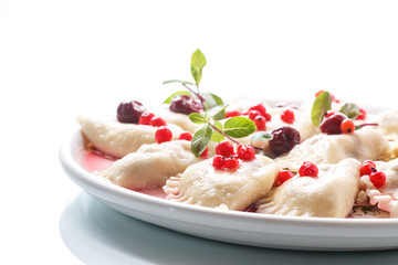 Sweet boiled dumplings with cherries and berries